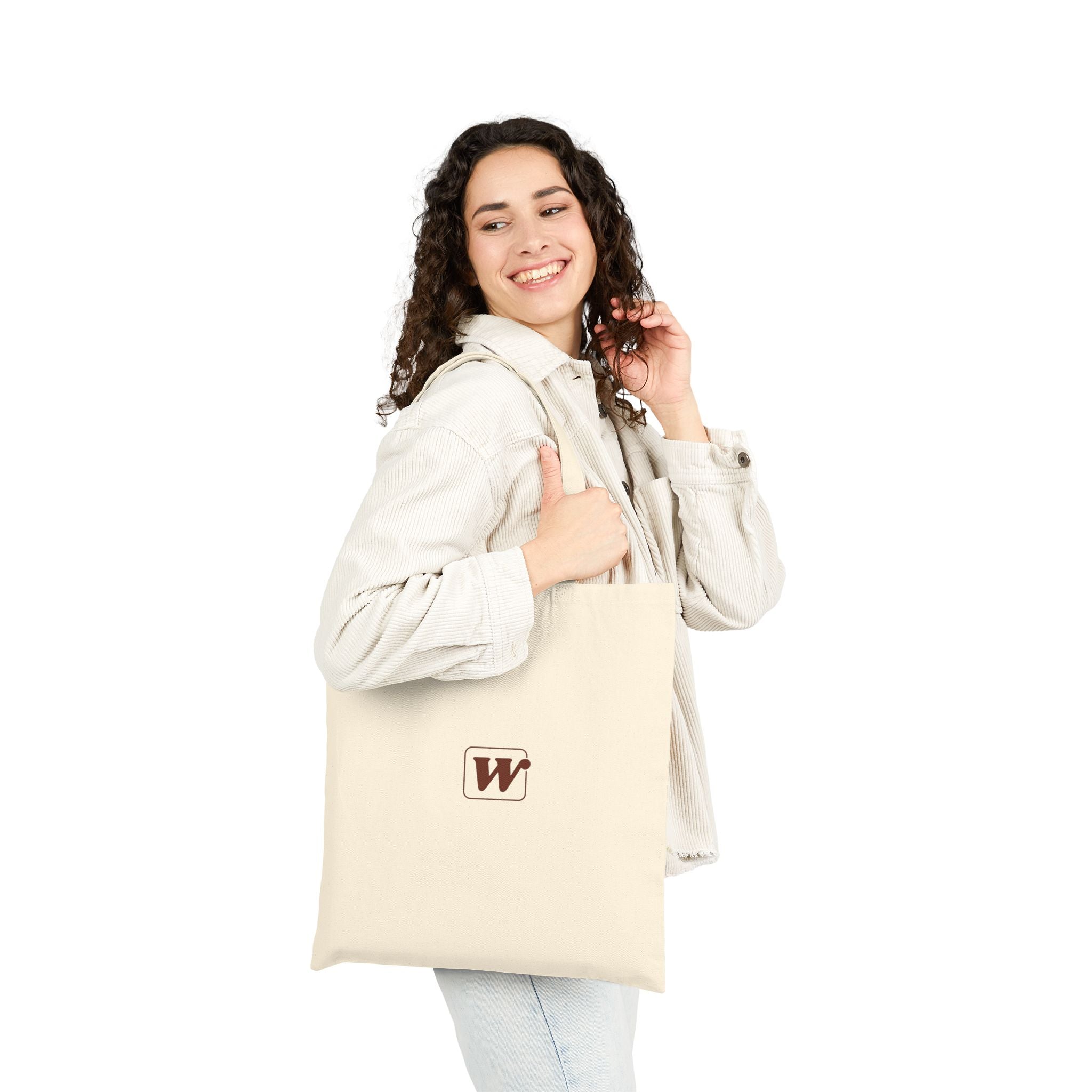 Canvas tote bag featuring an Espresso is served graphic with three clinking coffee mugs on the back and a front pocket W logo from The W-League collection