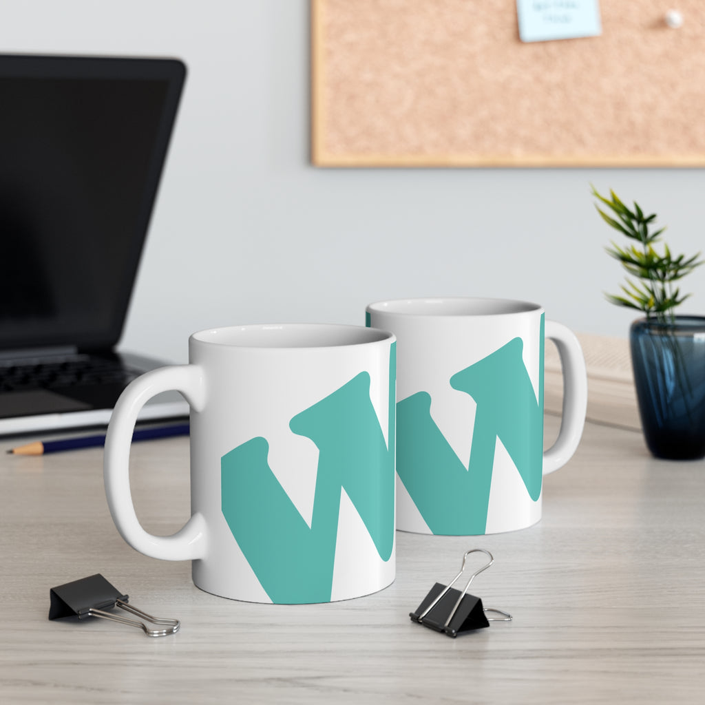 White ceramic coffee mug with teal W soccer club logo printed on the side from the WSC collection