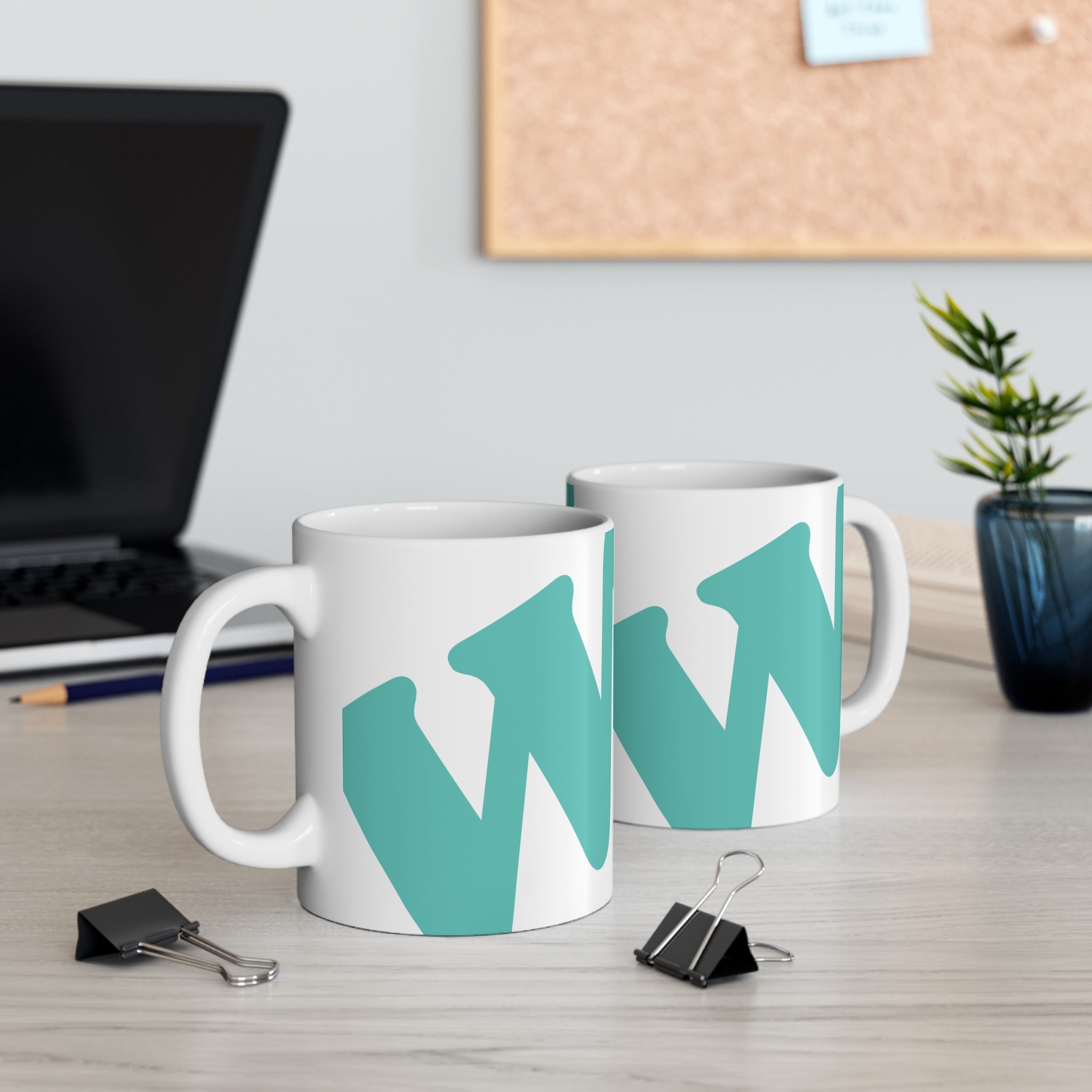 White ceramic coffee mug with teal W soccer club logo printed on the side from the WSC collection