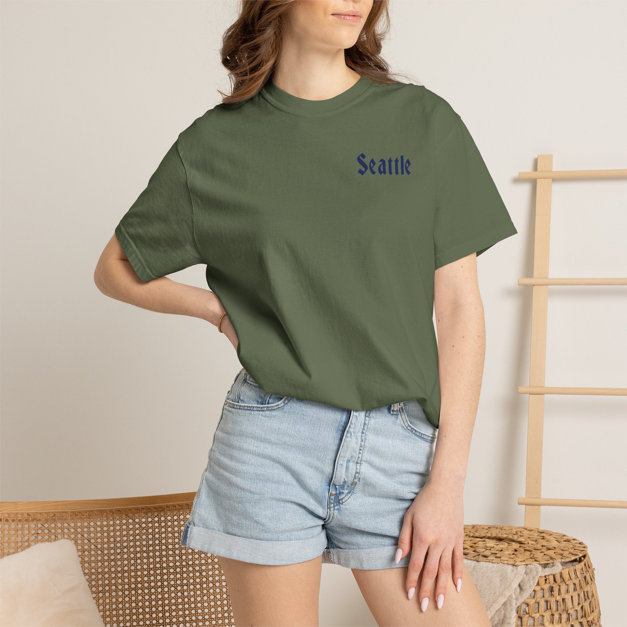 Sage heavyweight garment-dyed t-shirt front view featuring a minimal "Seattle" script on the left chest.