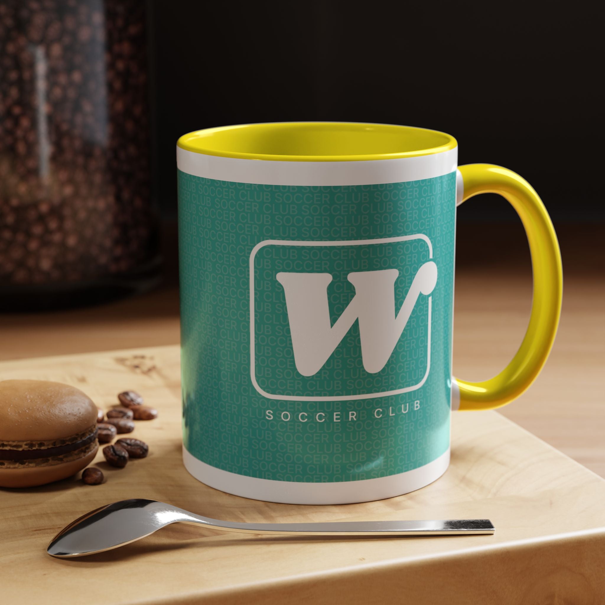 Yellow W Soccer Club ceramic accent mug, with a teal wraparound soccer club design and the bold 'W' logo 