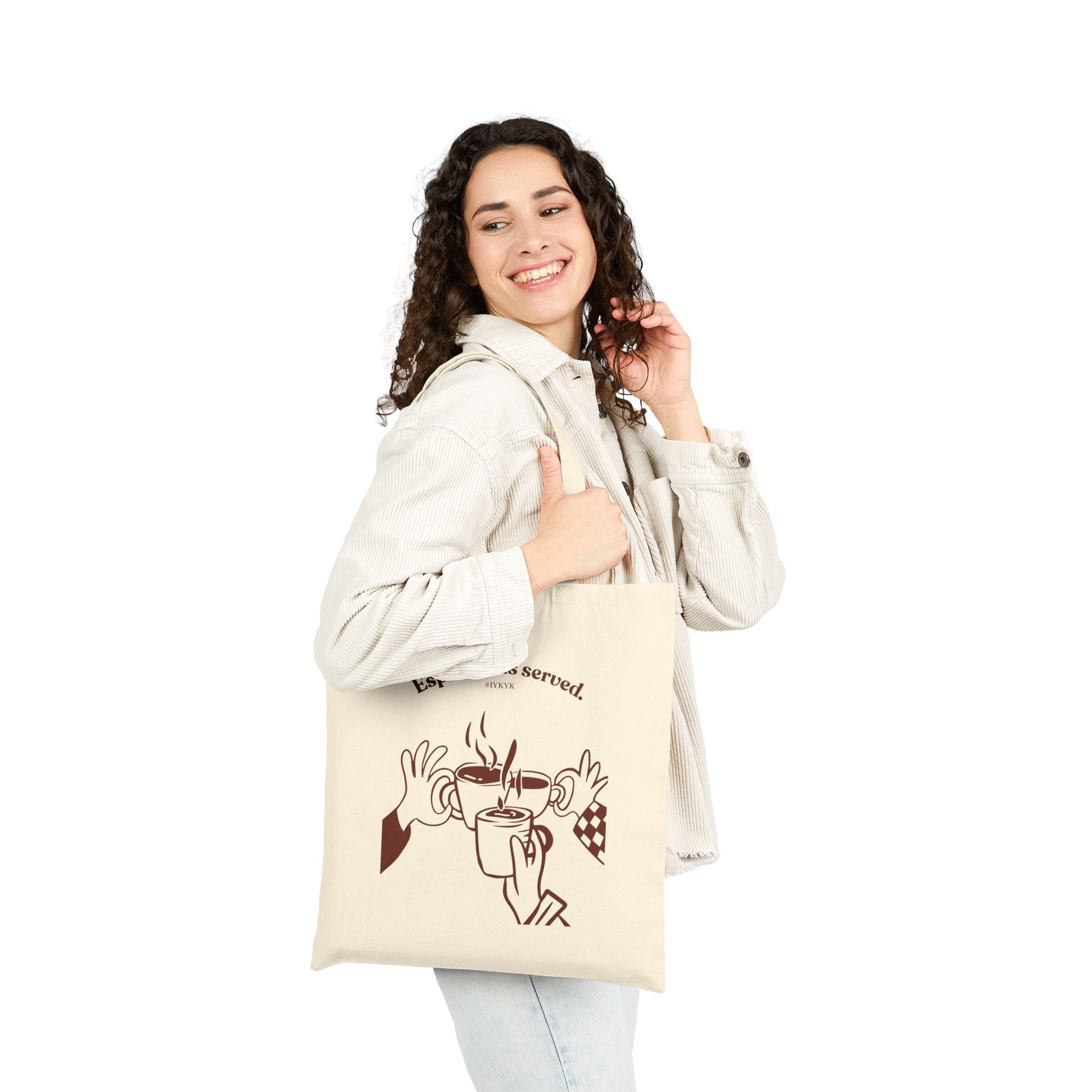 Canvas tote bag featuring an Espresso is served graphic with three clinking coffee mugs on the back and a front pocket W logo from The W-League collection