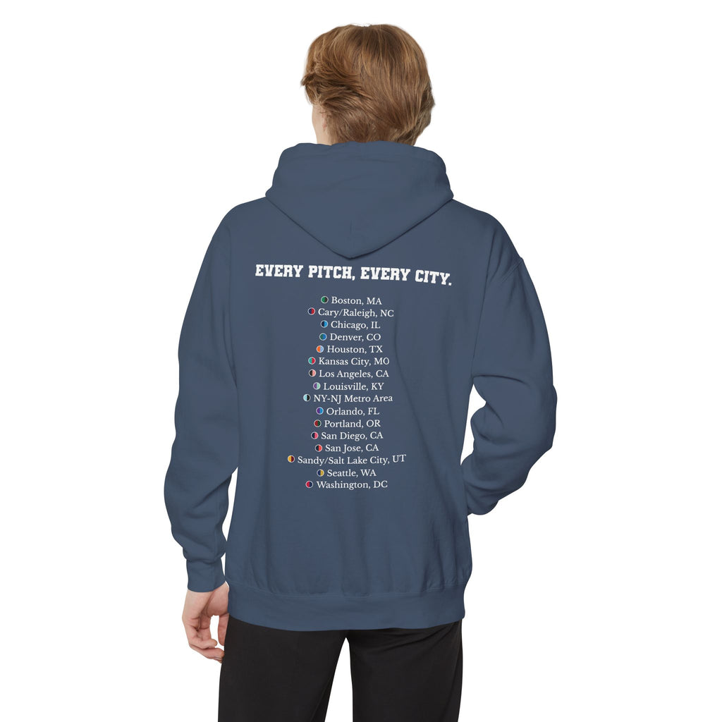 Denim colored hoodie with chest logo on the front and list of cities on the back