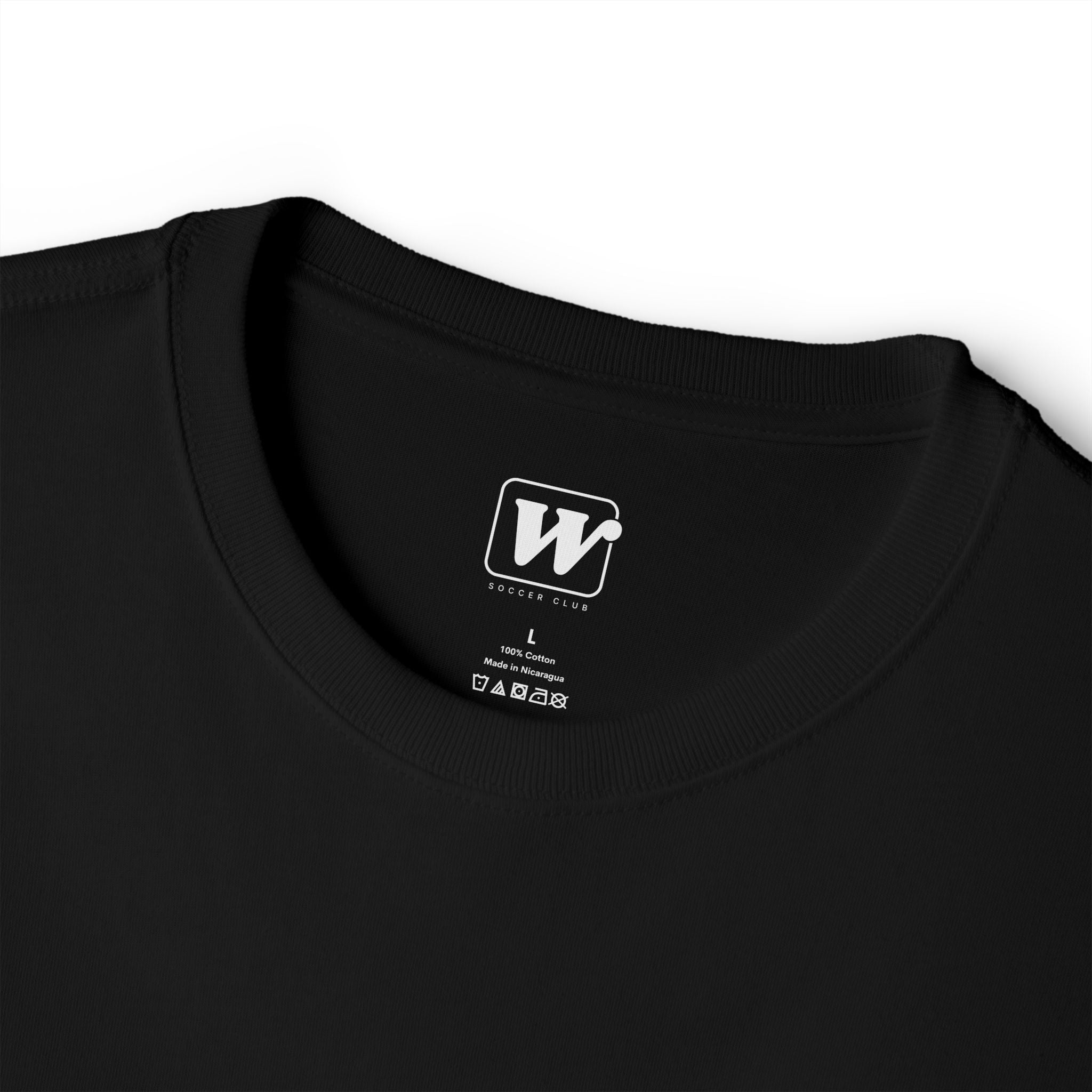 Black 'Elite Company Only' boxy t-shirt close-up showing the W Soccer Club logo on the inside tag