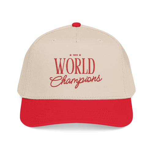 A beige and red baseball cap with '1999 World Champions' embroidered in red on the front, set against a plain white background.