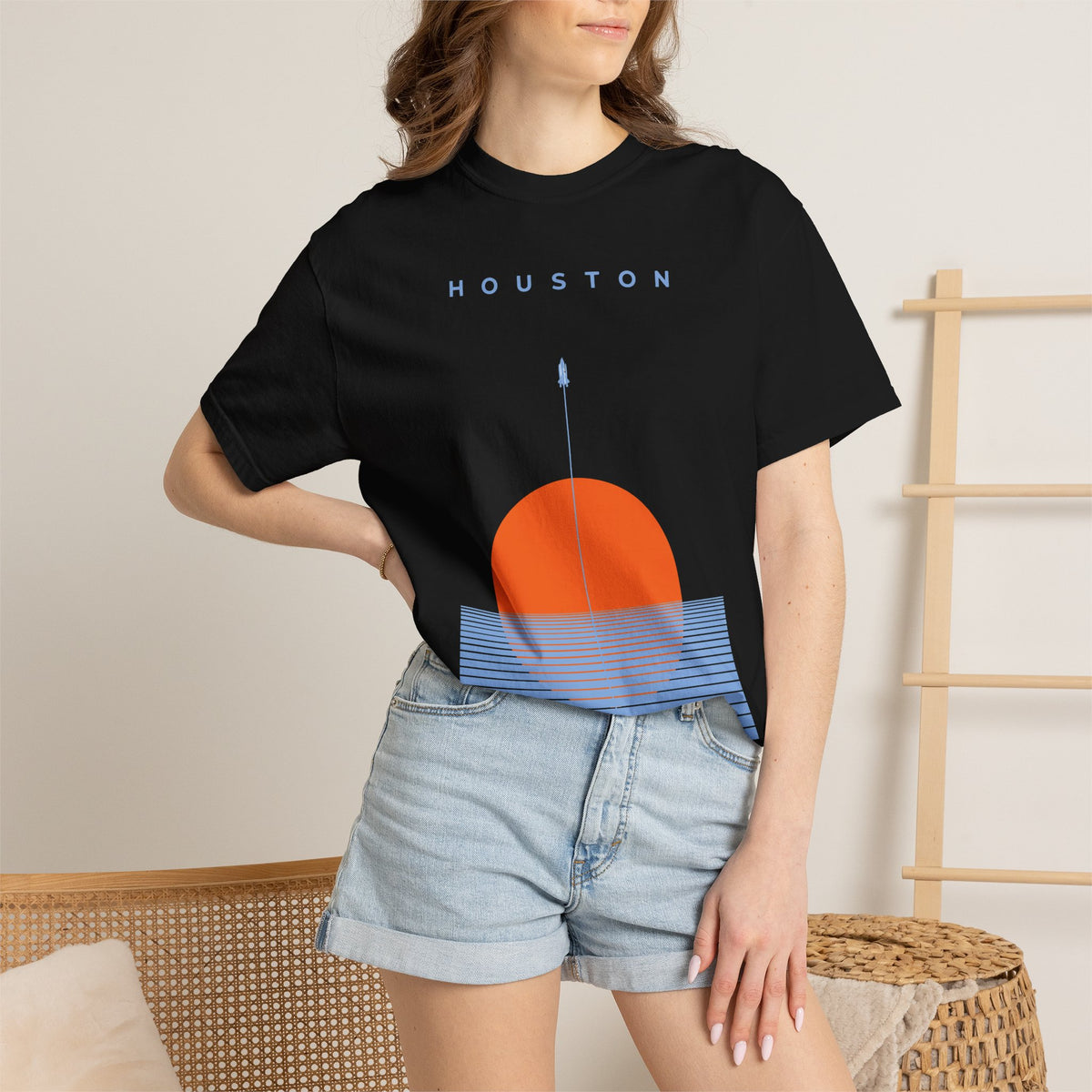 Black Houston Space City Sunset Soccer Graphic Tee with sunset design being worn on model