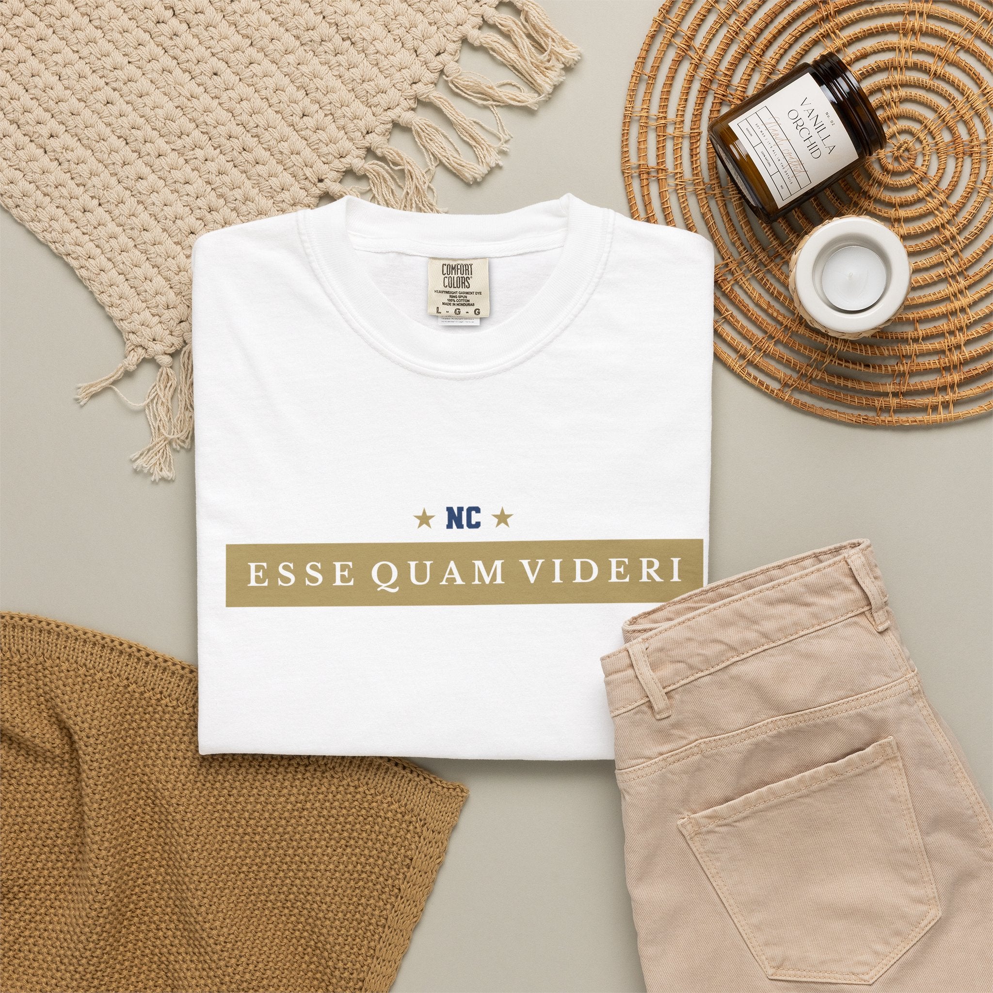 White garment-dyed t-shirt front view featuring 'ESSE QUAM VIDERI' text in a horizontal chest bar.
