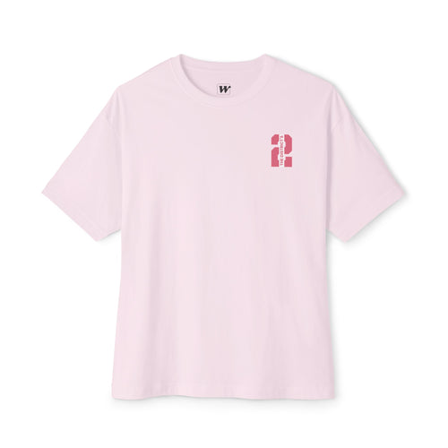 Soft Pink heavyweight boxy t-shirt front view featuring a minimal "The District's 2" graphic printed on the left chest.