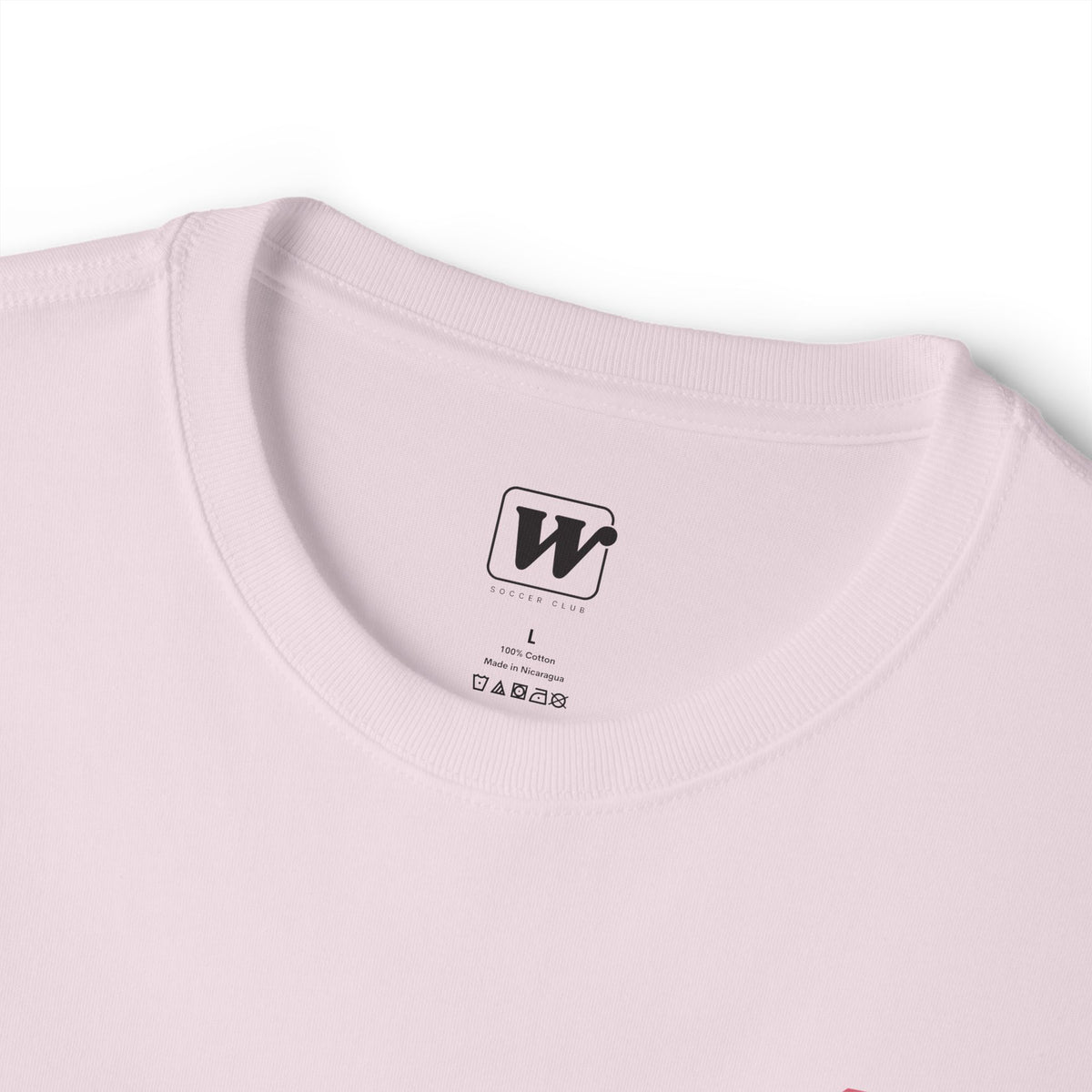 Soft Pink boxy t-shirt close-up showing the inner neck label with a small W Soccer Club logo.