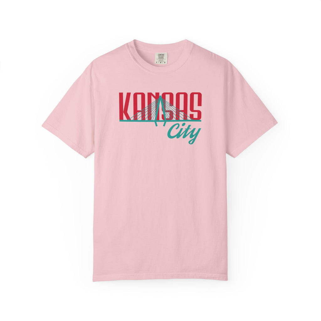 Blossom pink garment-dyed t-shirt front view featuring "Kansas City" with bridge graphic in red and teal retro script across the chest.