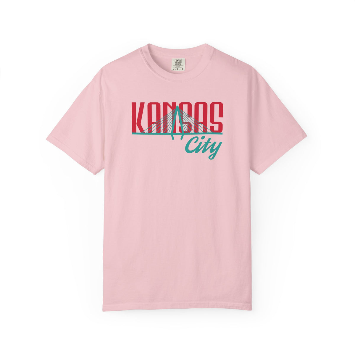 Blossom pink garment-dyed t-shirt front view featuring "Kansas City" with bridge graphic in red and teal retro script across the chest.