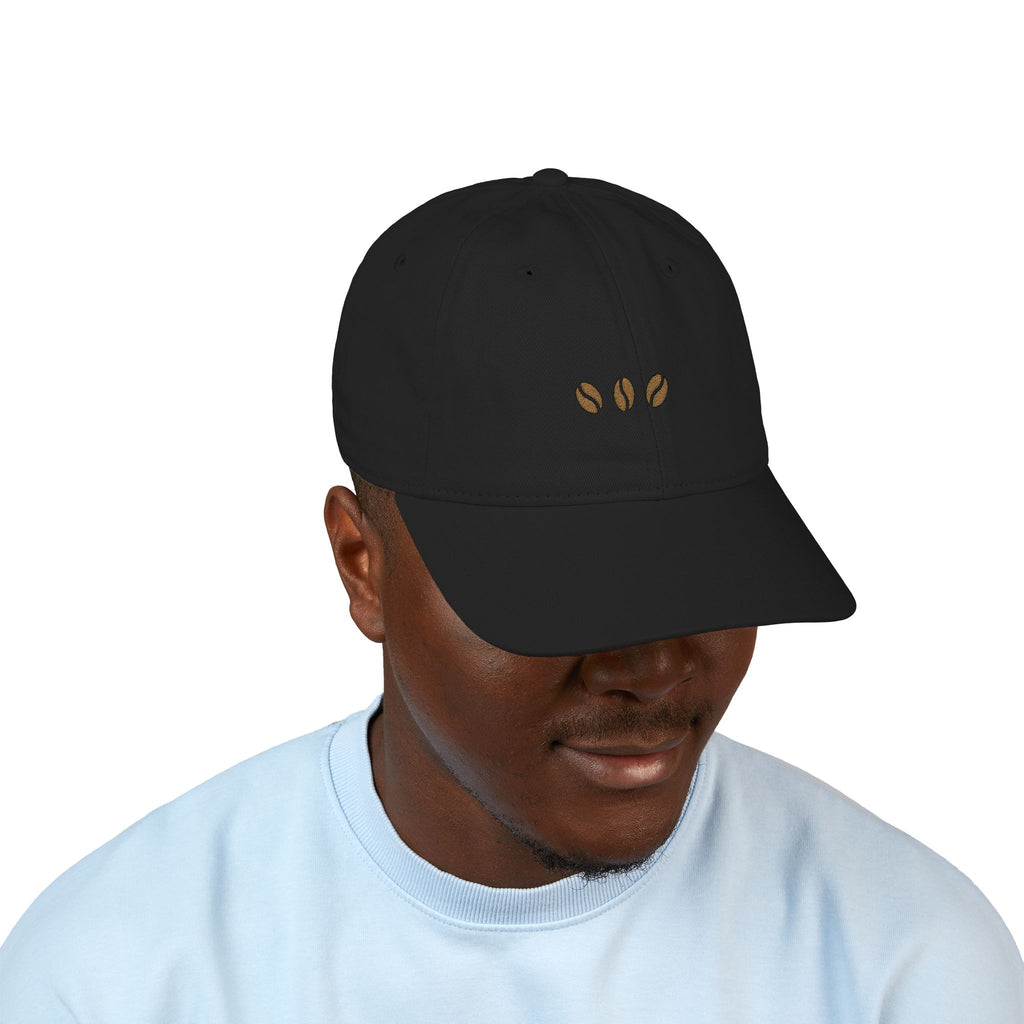 Black unstructured beige baseball cap with three embroidered coffee beans across the front