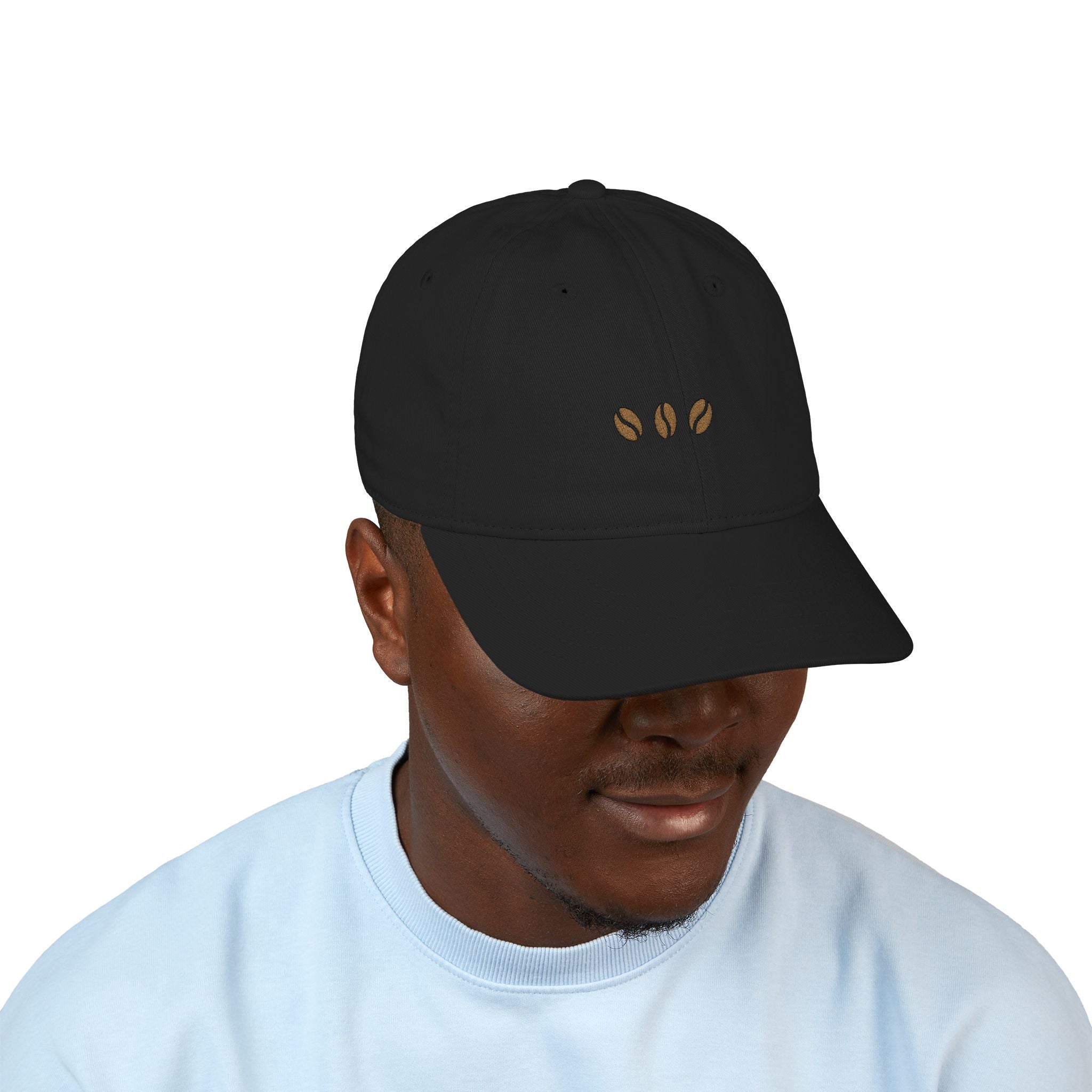 Black unstructured beige baseball cap with three embroidered coffee beans across the front