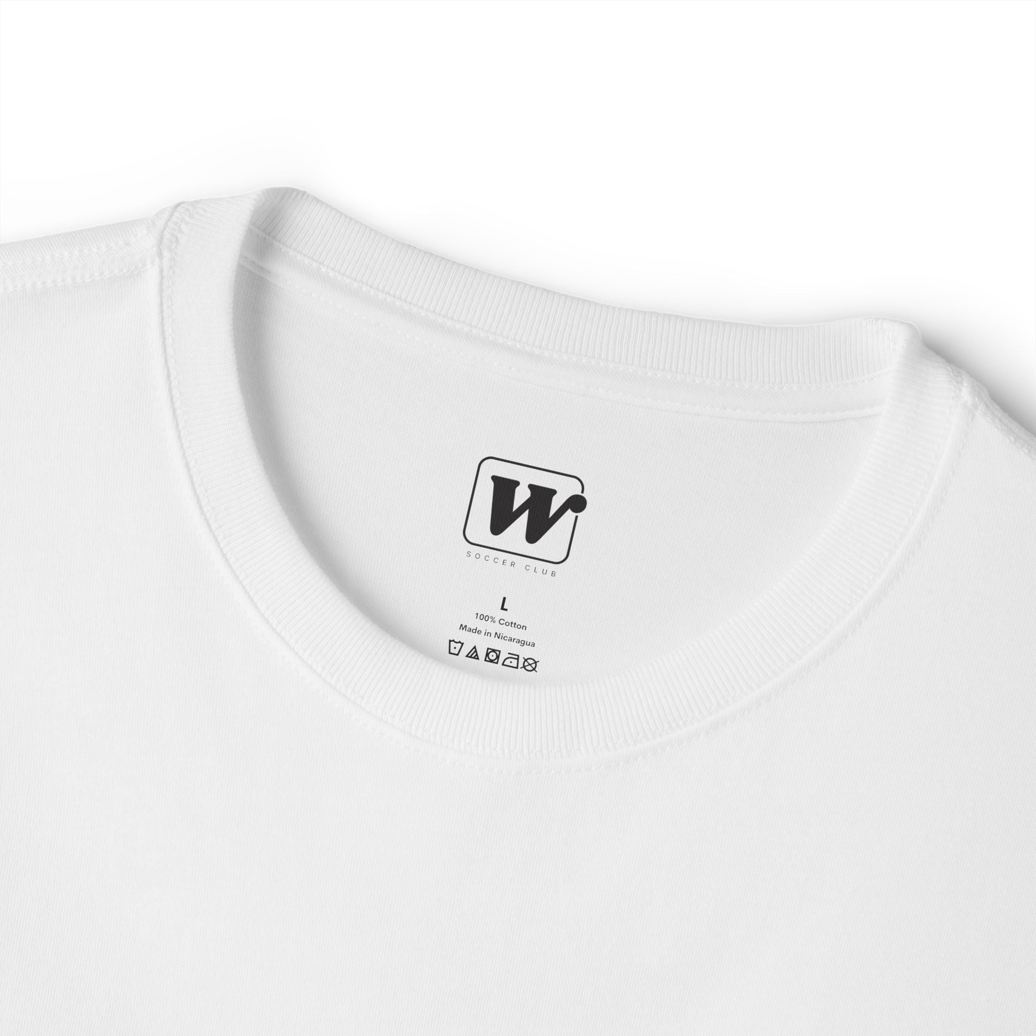 White 'Elite Company Only' boxy t-shirt close-up showing W Soccer Club logo on the inside tag