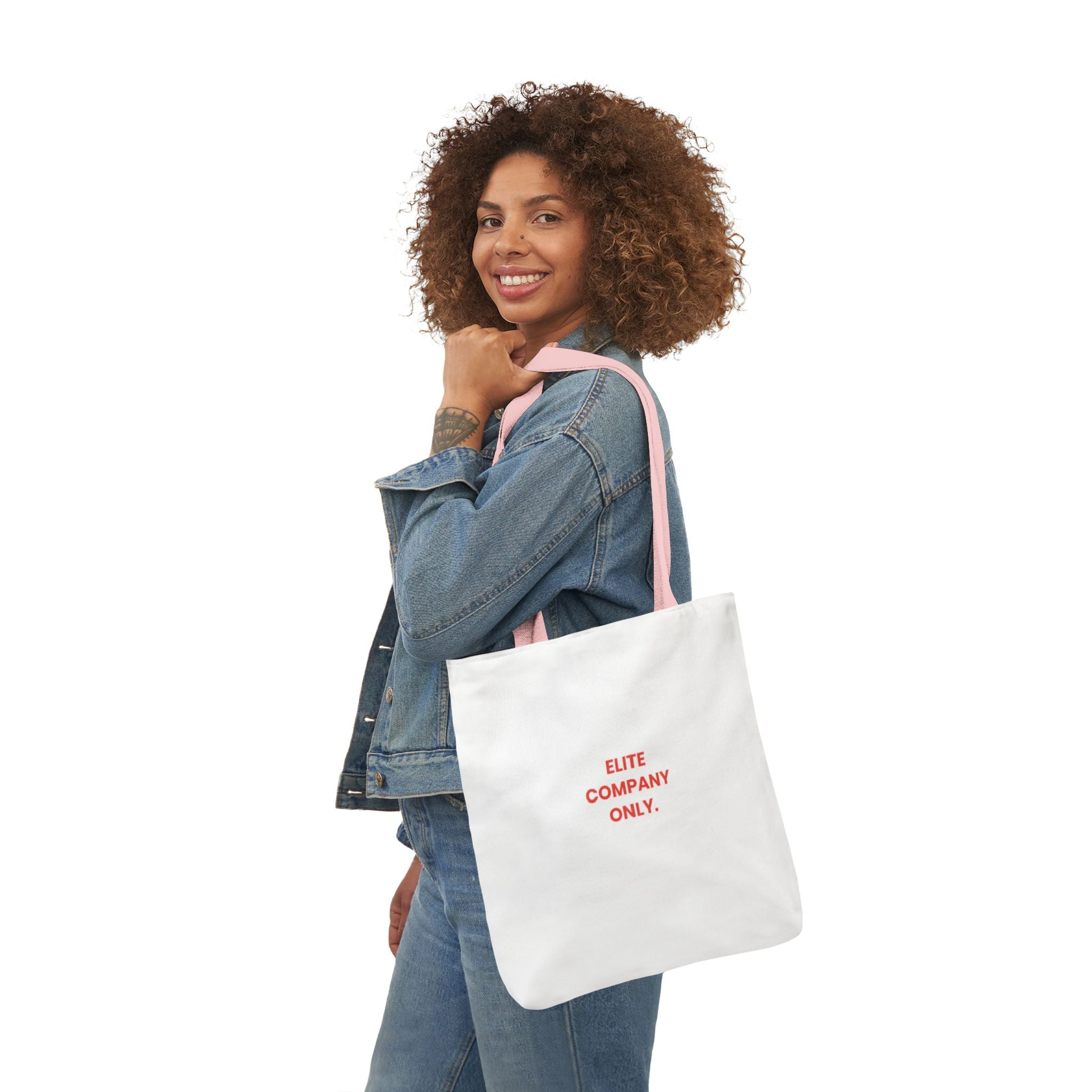 A canvas tote bag with light pink shoulder straps, featuring the text 'Elite Company Only'