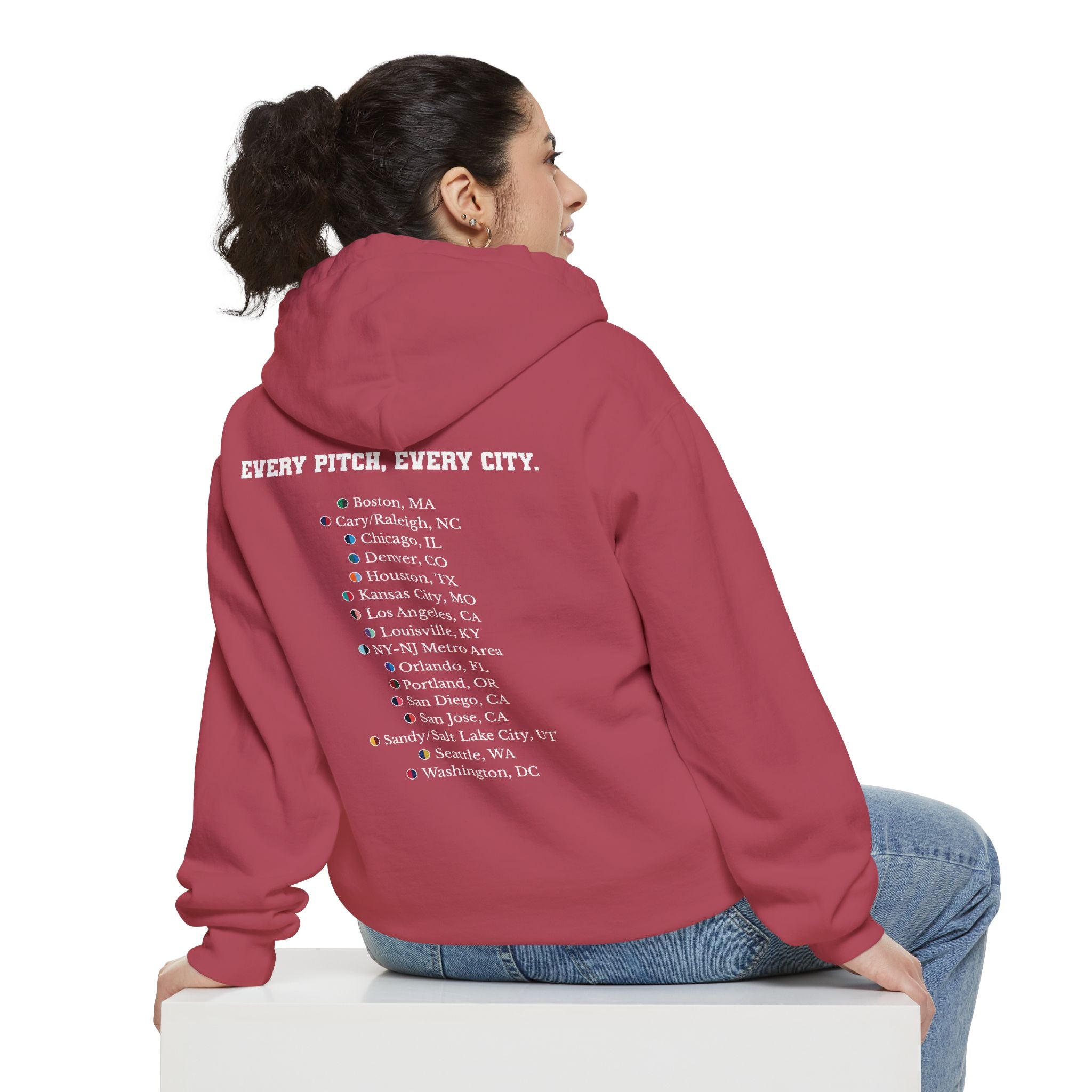 Crimson hoodie with chest logo on the front and list of cities on the back