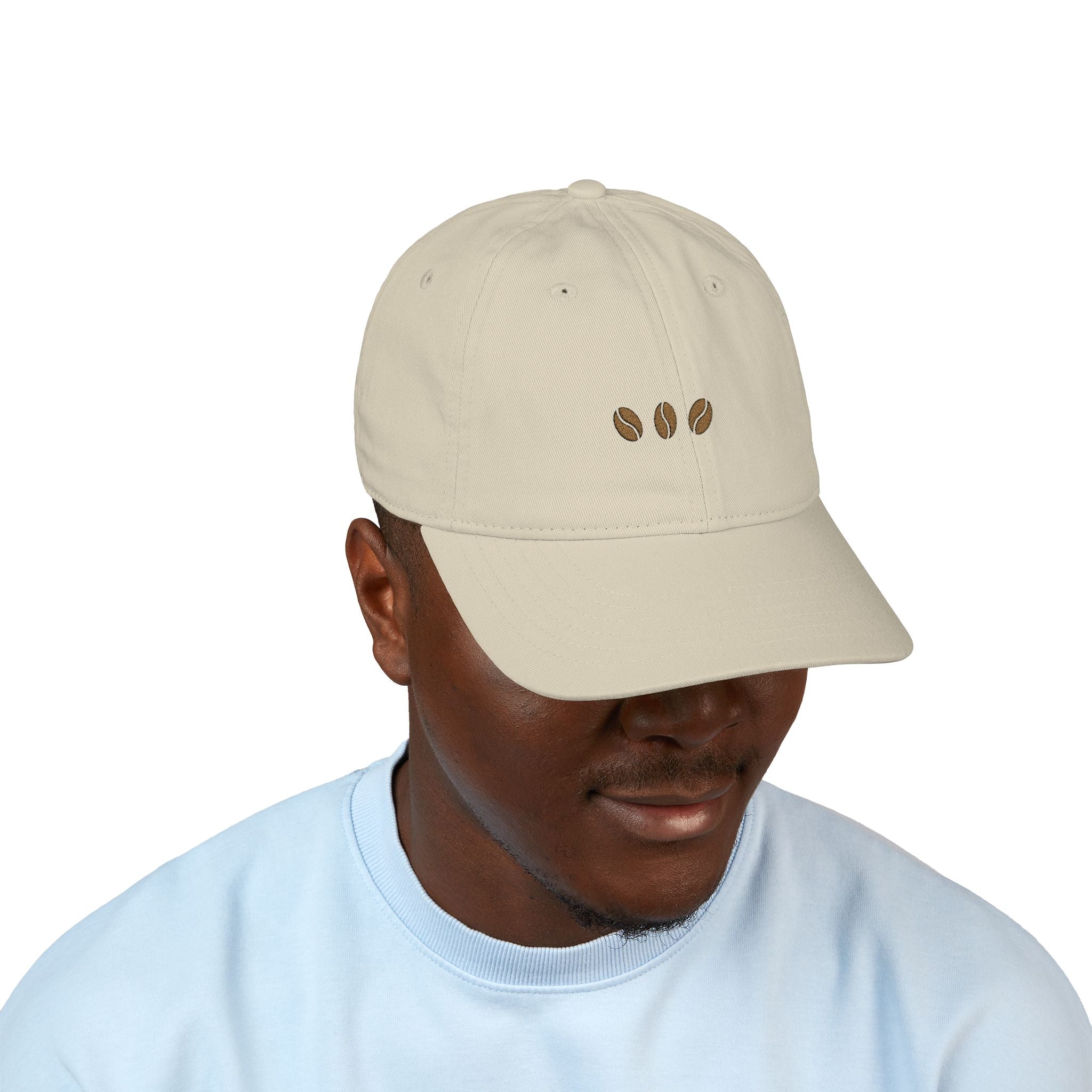 Oyster unstructured beige baseball cap with three embroidered coffee beans across the front