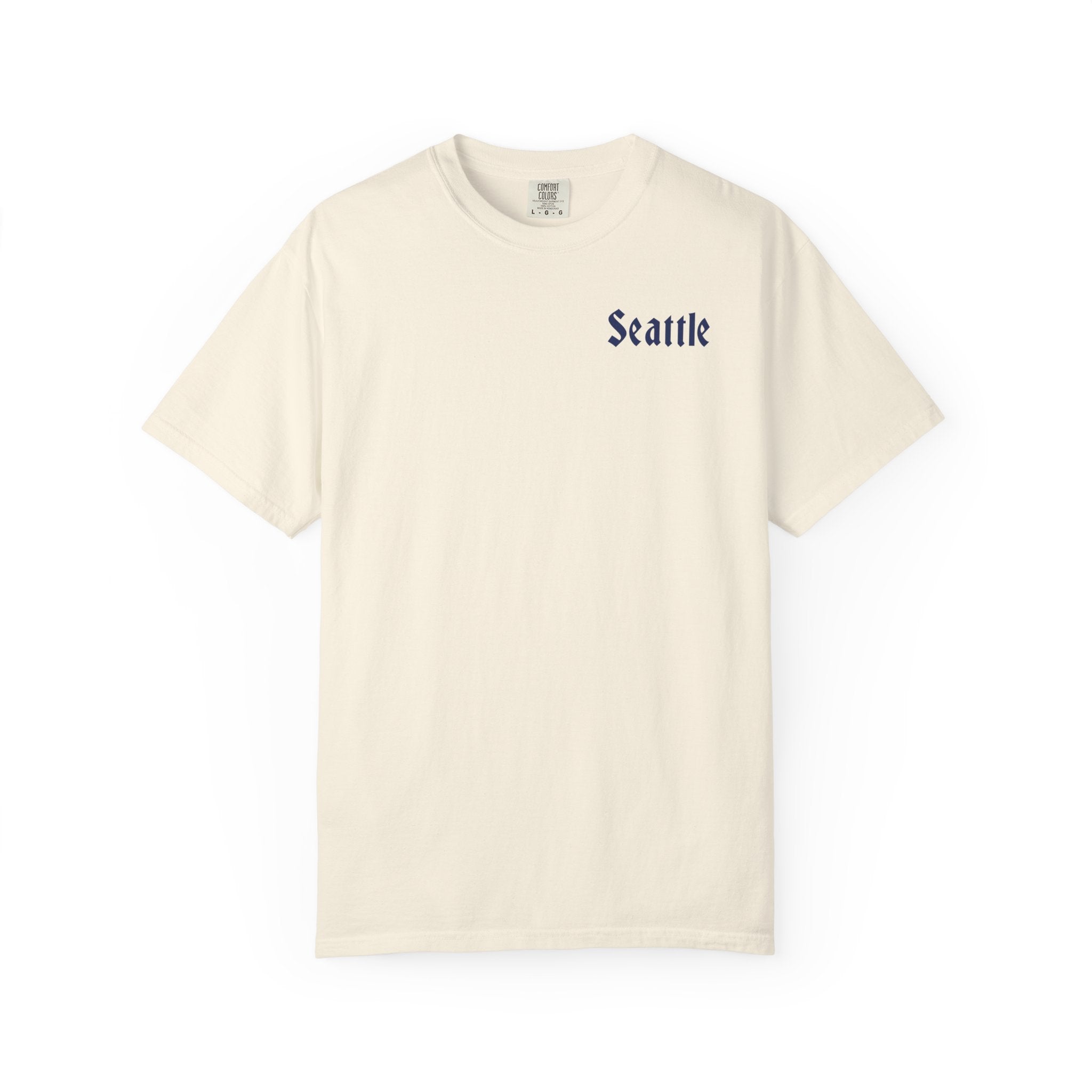 Ivory heavyweight garment-dyed t-shirt front view featuring a minimal "Seattle" script on the left chest.