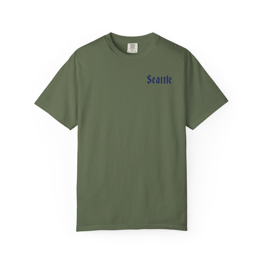 Sage heavyweight garment-dyed t-shirt front view featuring a minimal "Seattle" script on the left chest.