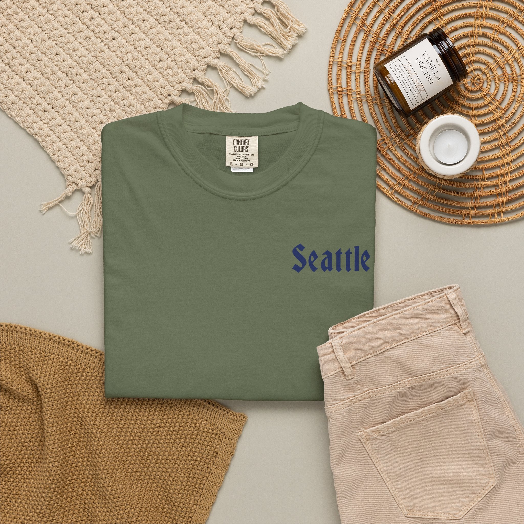 Sage heavyweight garment-dyed t-shirt front view featuring a minimal "Seattle" script on the left chest.