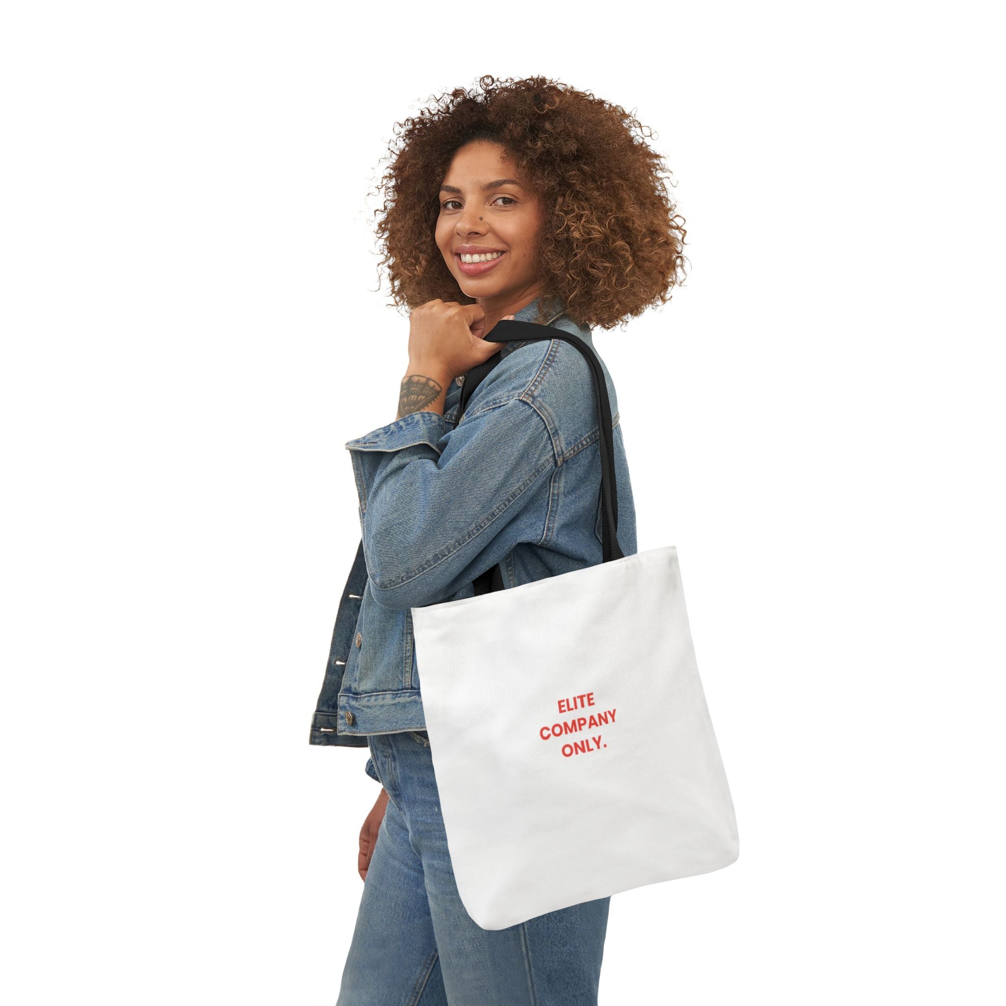 A canvas tote bag with black shoulder straps, featuring the text 'Elite Company Only'
