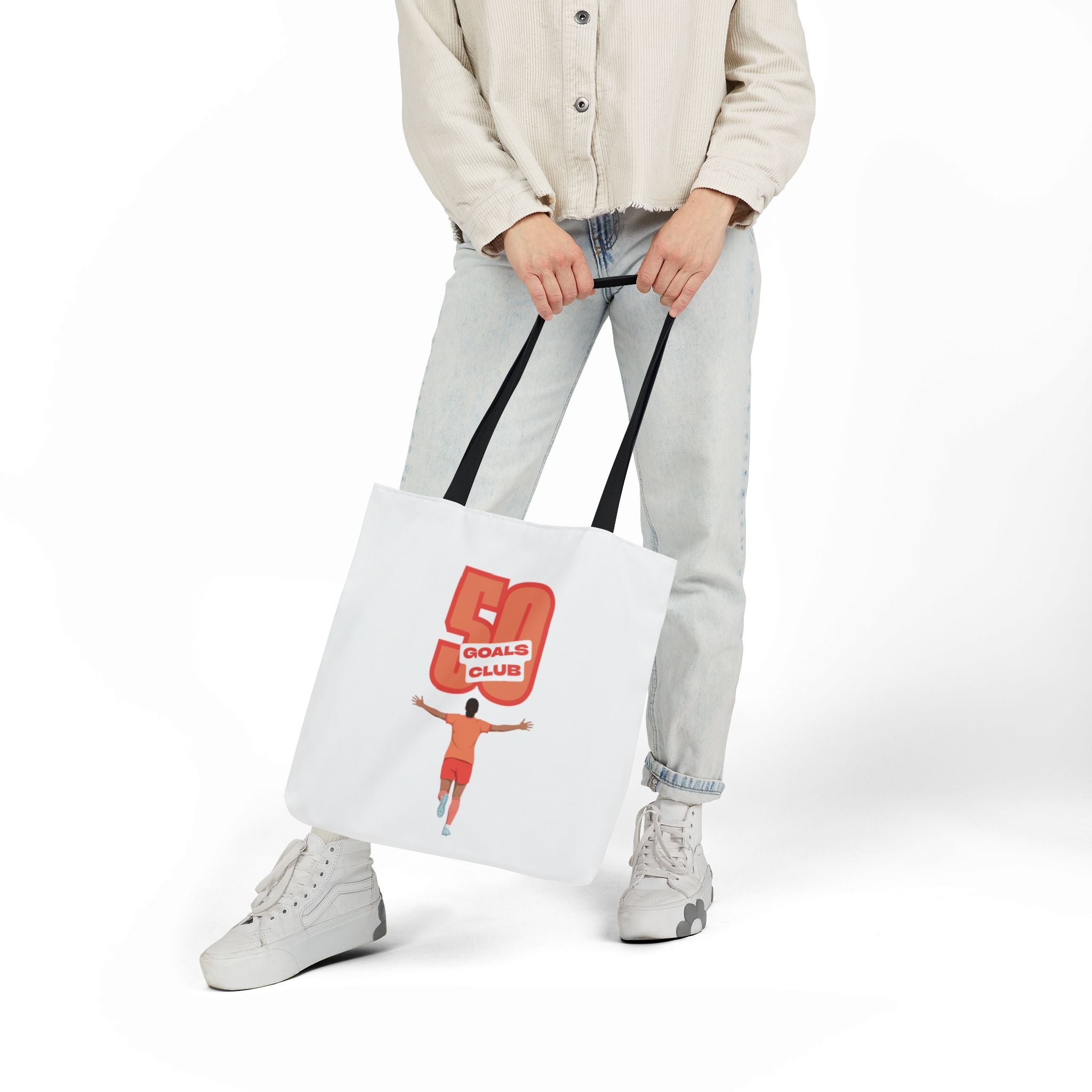 A canvas tote bag with black shoulder straps, featuring a graphic print of a player running underneath a '50 GOALS CLUB' design.