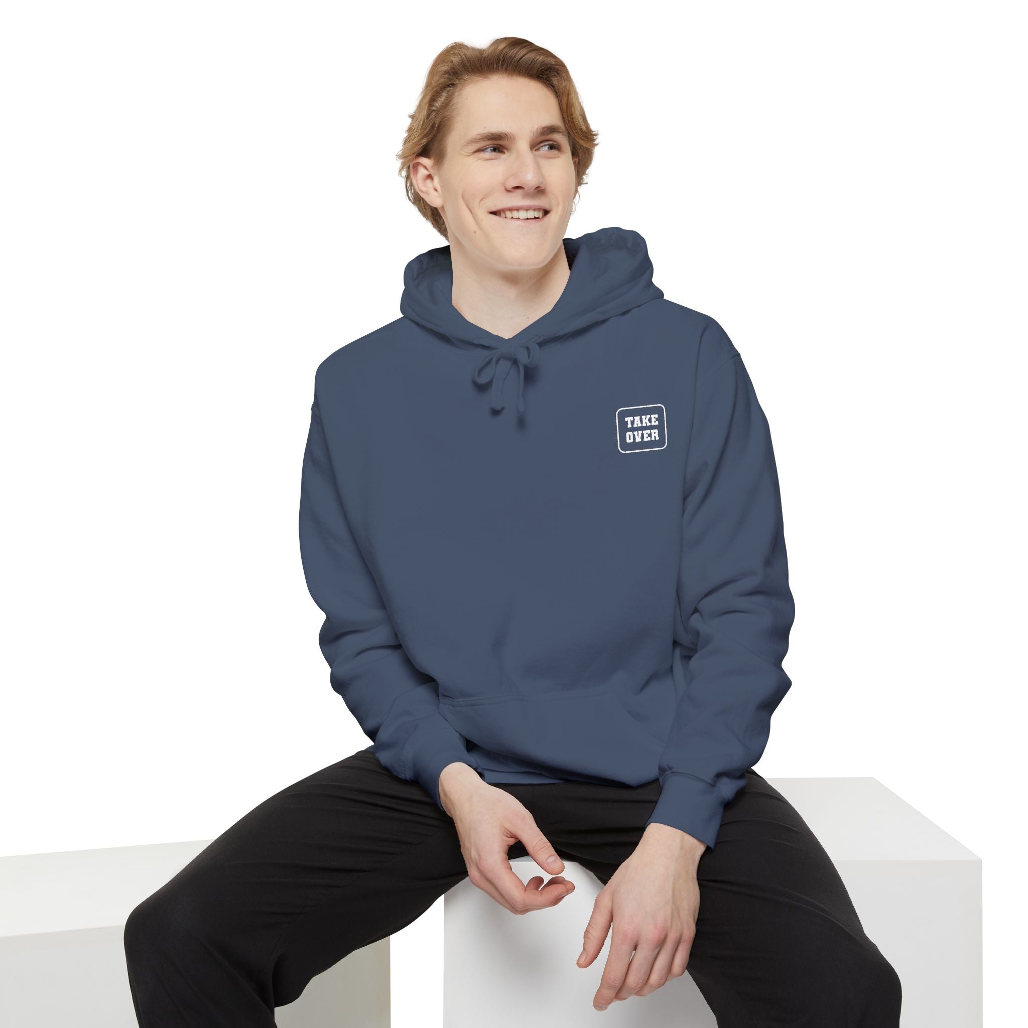 Denim colored hoodie with chest logo on the front and list of cities on the back
