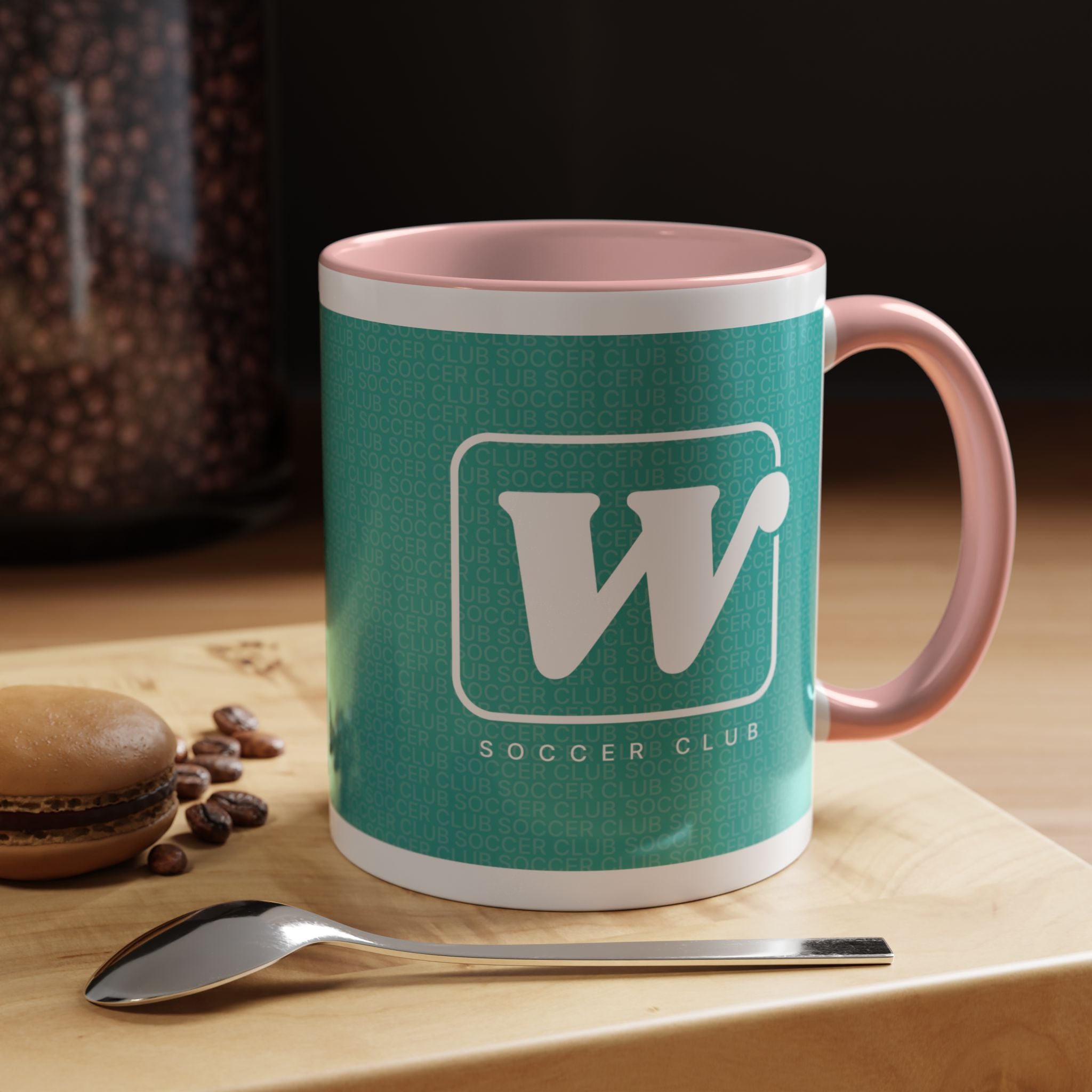 Pink W Soccer Club ceramic accent mug, with a teal wraparound soccer club design and the bold 'W' logo 