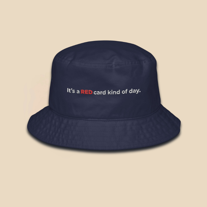 Navy embroidered soccer fan bucket hat featuring the text "It's a red card kind of day" in high-contrast typography