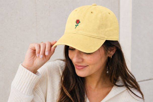 Butter Nutmeg Duchess rose graphic dad hat featuring a vintage style embroidered red rose motif and classic fit